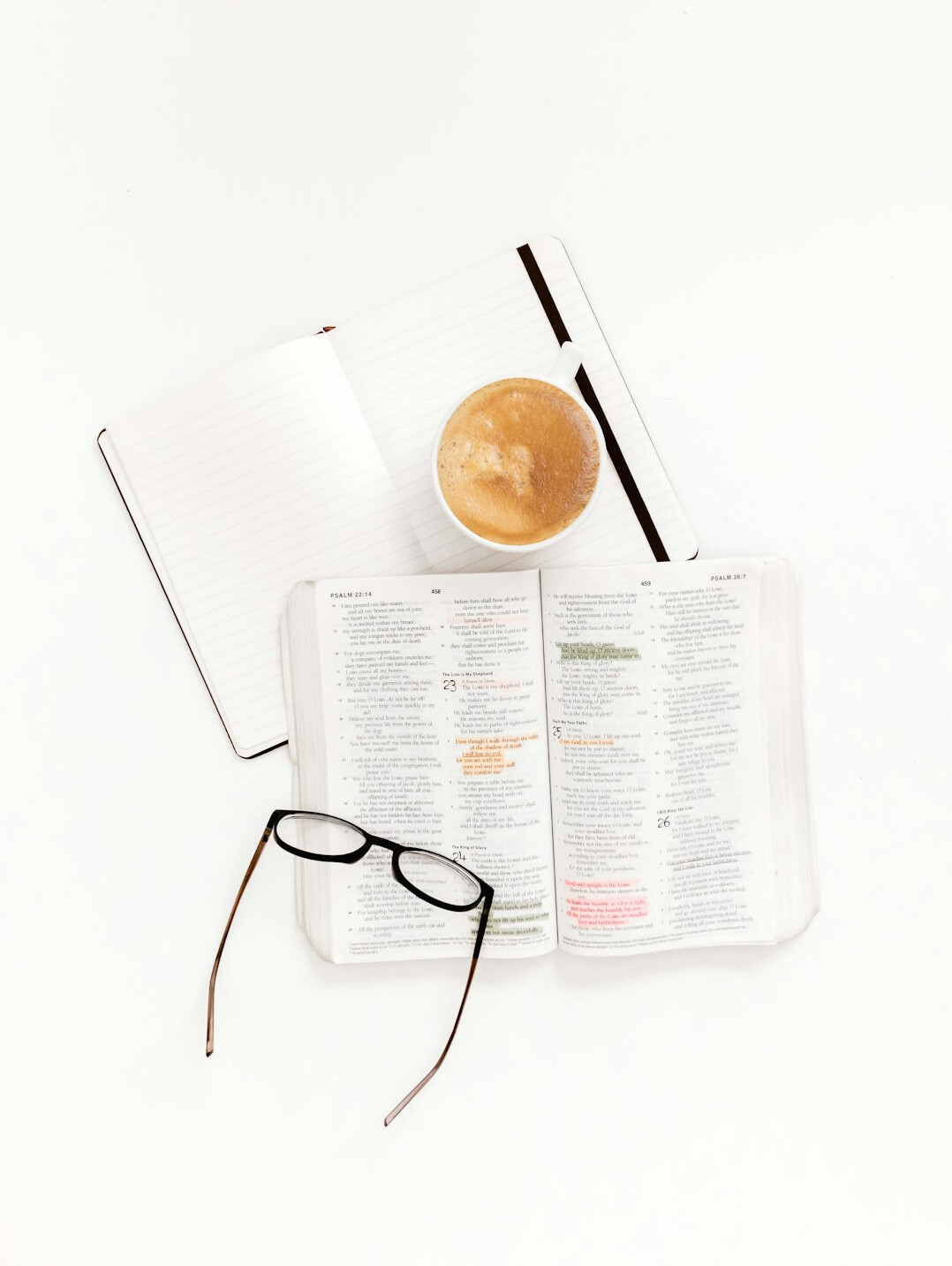 Desk with calculator, reading glasses and notebook with retirement planning notes