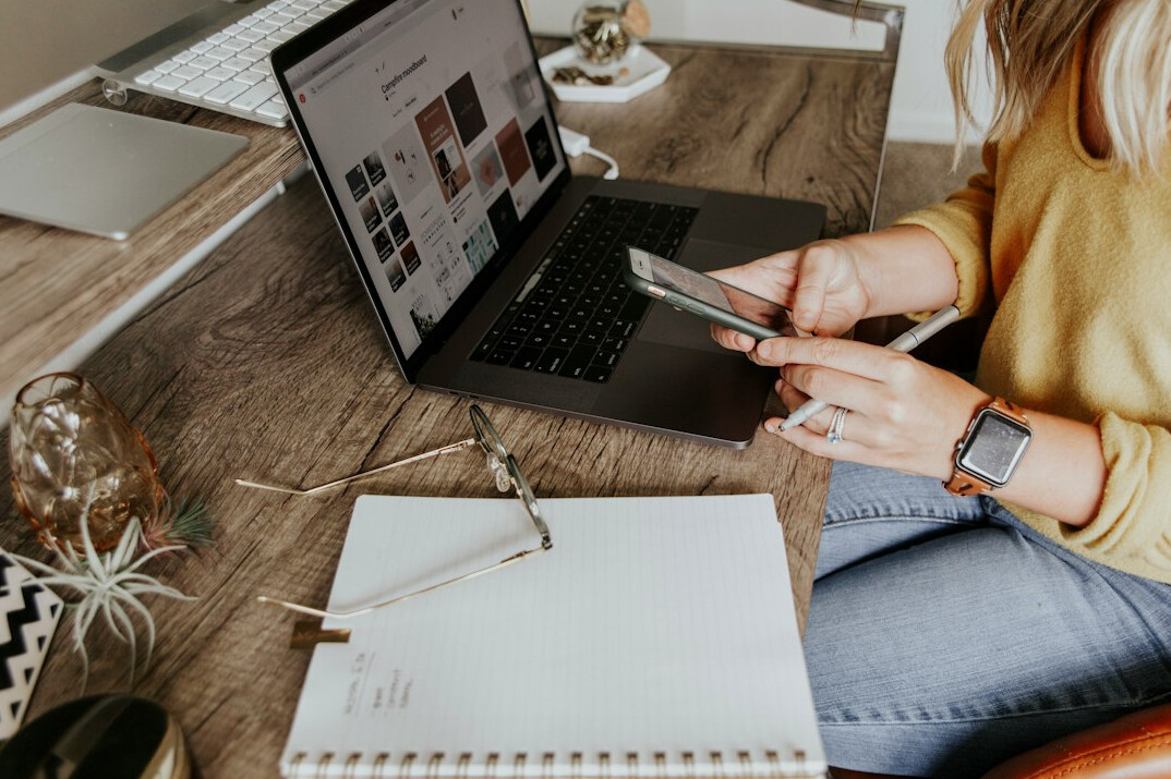 woman calculating expenses on laptop