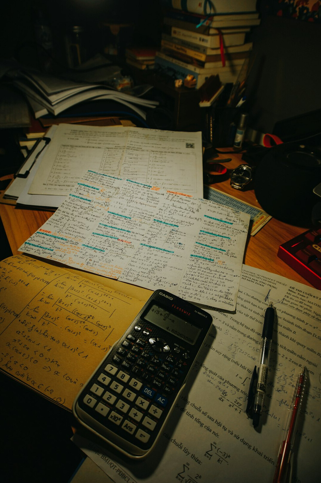 person reviewing debt statements at desk