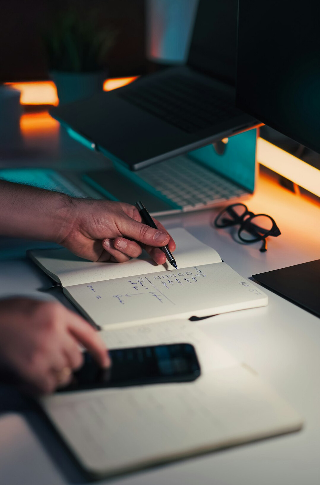 person using calculator at desk